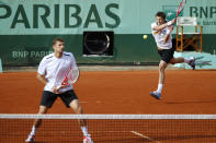 Belarus Max Mirnyi (L) and Canada's Daniel Nestor (R) hit a return to US Bob Bryan and US Mike Bryan during Men's Doubles final tennis match of the French Open tennis tournament at the Roland Garros stadium, on June 9, 2012 in Paris. AFP PHOTO / THOMAS COEXTHOMAS COEX/AFP/GettyImages