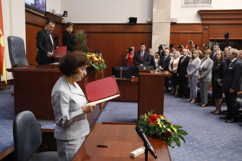 Gordana Siljanovska Davkova takes an oath as the new President of North Macedonia in front of the lawmakers, during an inauguration ceremony at the parliament building in Skopje, North Macedonia, on Sunday, May 12, 2024. Siljanovska Davkova has sworn as first female president in North Macedonia on Sunday after her triumph in a presidential runoff earlier this week over the leftist incumbent president. (AP Photo/Boris Grdanoski)