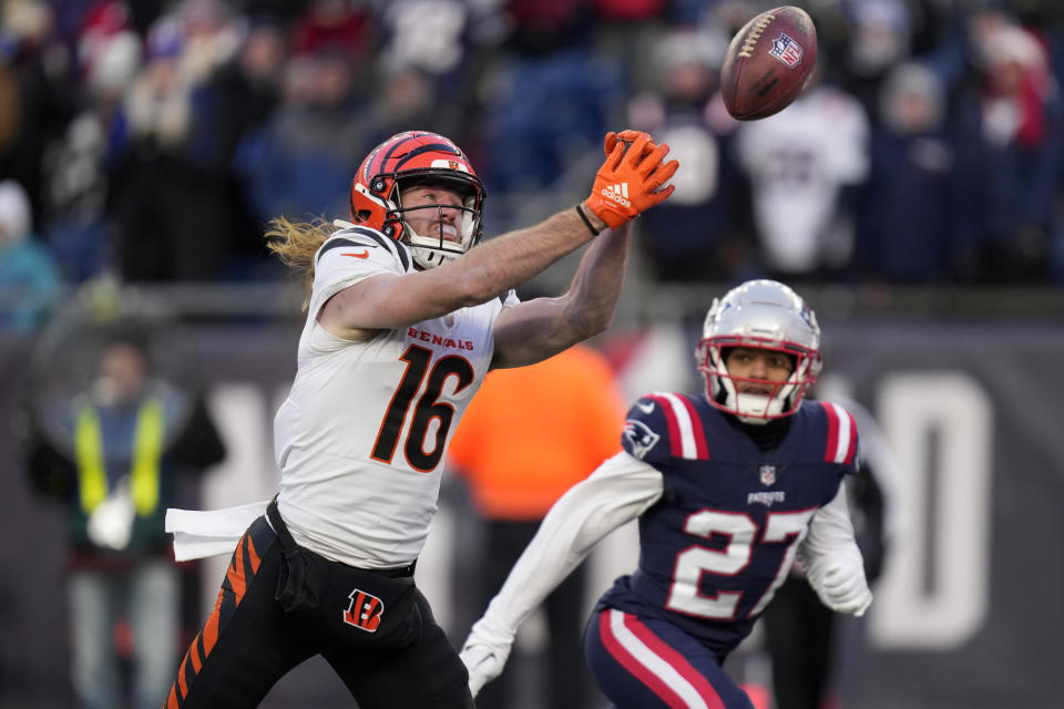 Cincinnati Bengals wide receiver Trenton Irwin (16) reaches for the ball for an incomplete touchdown pass as New England Patriots cornerback Myles Bryant (27) tries to defend during the second half of an NFL football game, Saturday, Dec. 24, 2022, in Foxborough, Mass. (AP Photo/Charles Krupa)