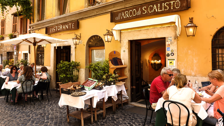 diners eating outside in Italy