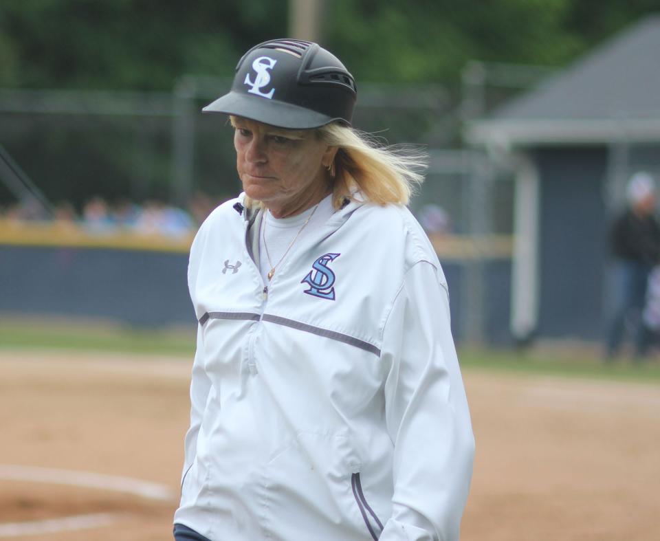 South Lenoir coach Lisa Smith walks towards the dugout Wednesday at Washington. Her team is in the 2-A East Regional final series for the first time since 2013.