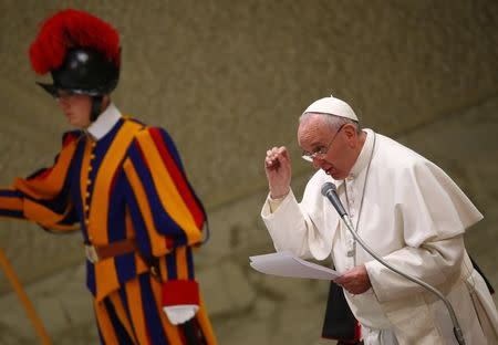 Pope Francis delivers his speech during a special audience with members of the confederation of Italian cooperatives in Paul VI hall at the Vatican February 28, 2015. REUTERS/Tony Gentile