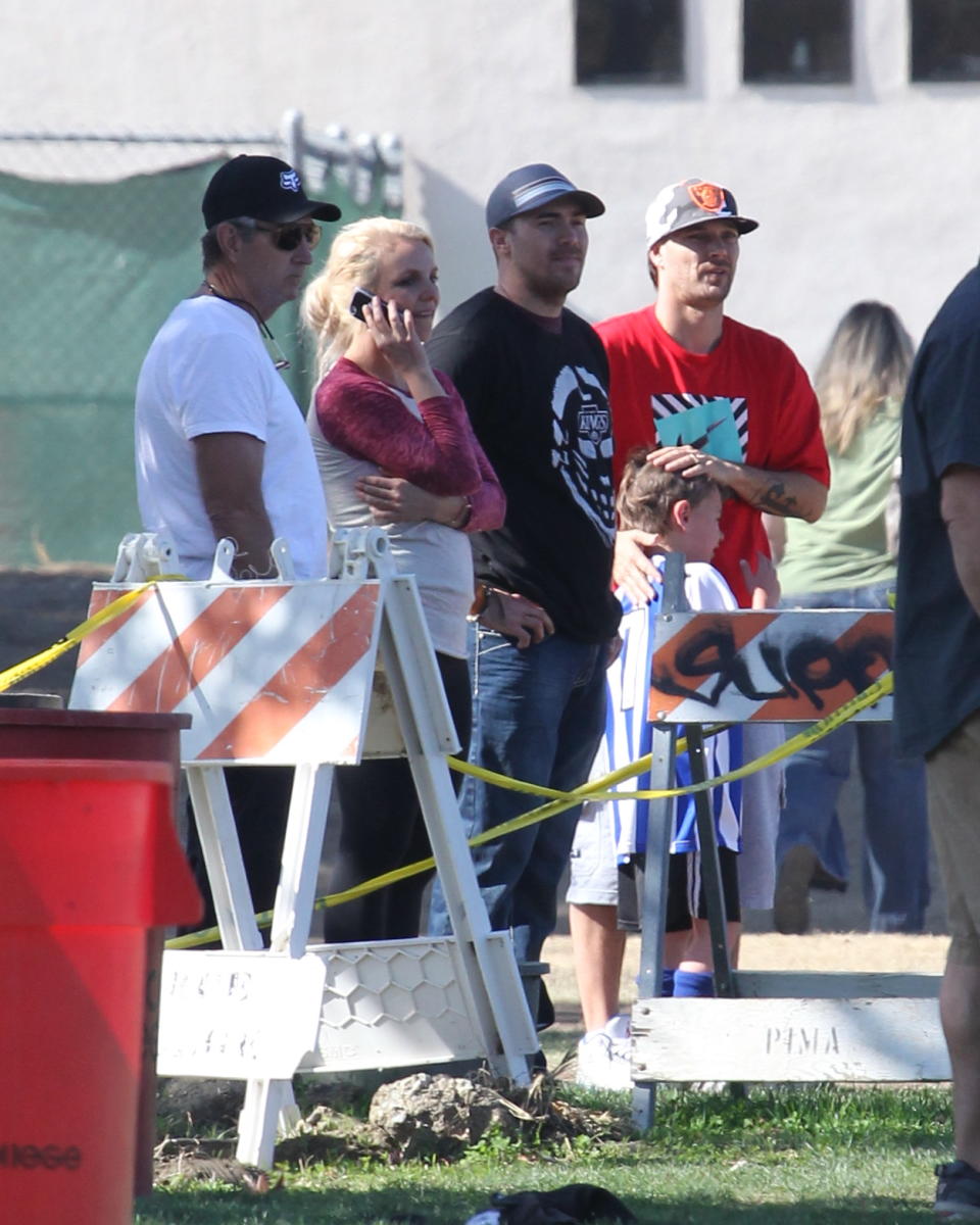 In 2013, things between Britney and Kevin were cordial enough that they could be near each other at their sons’ sporting events but were never alone together. Here they are, along with Jamie Spears, left, and Britney’s ex-boyfriend David Lucado, second from right. (Photo: Splash News)