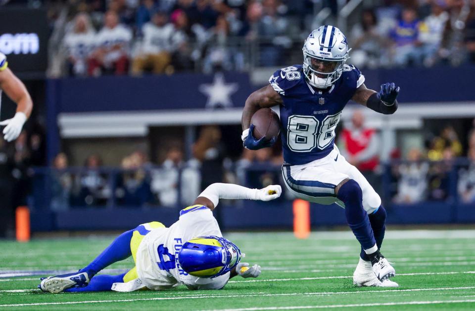 Oct 29, 2023; Arlington, Texas, USA; Dallas Cowboys wide receiver CeeDee Lamb (88) runs with the ball as Los Angeles Rams safety Jordan Fuller (4) defends during the first half at AT&T Stadium. Mandatory Credit: Kevin Jairaj-USA TODAY Sports