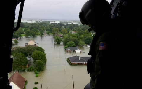 A shivering three-year-old girl found clinging to the body of her drowned mother in a rain-swollen canal in Southeast Texas was likely saved by her mother's effort to carry her child to safety from Harvey's floods, police said on Wednesday. Beaumont police identified the mother as 41-year-old Colette Sulcer and said her daughter was being treated for hypothermia but doing well. When rescuers found the mother and daughter, the girl was on her mother's back, holding on, said Police Officer Haley Morrow. "I envision what I would do if that was me in that situation and that's what I would do: I would put my child on my back and try to swim to safety or whatever," Morrow said. Hurricane Harvey hits Texas, in pictures Sulcer's vehicle got stuck Tuesday afternoon in the flooded parking lot of an office park just off Interstate 10, said Capt. Brad Penisson of the fire-rescue department in Beaumont. Squalls from Harvey were pounding Beaumont with up to 2 inches (5 centimeters) of rain an hour with 38 mph (60 kph) gusts, according to the National Weather Service. A witness saw the woman take her daughter and try to walk to safety when the swift current of a flooded drainage canal next to the parking lot swept them both away, Penisson said. Morrow said the woman's actions probably saved her little girl's life. "When they found her she was still up out of the water," Morrow said. The US Coast Guard responds to search and rescue requests in response to Hurricane Harvey in the Beaumont, Texas Credit: EPA A police and fire-rescue team in a boat caught up to them a half-mile downstream from Sucler's vehicle, according to Penisson. Rescuers pulled them into the boat just before they would have gone under a railroad trestle where the water was so high that the boat could not have followed. First responders lifted the child from her mother's body and tried to revive the woman, but she never regained consciousness. A citizen allowed first responders to load the mother and daughter into his truck and he brought them to a waiting ambulance, Morrow said. The sacrificial love of a mother was demonstrated down in TX, RIP Colette Sulcer - You will not be forgotten #MothersLove#ForeverLove— Motivated Patriot (@aroesta) August 30, 2017 This woman is a true hero and her daughter will always know her mom saved her. #ColetteSulcer— Toby (@realBrowncoat) August 30, 2017 The child was taken to the Christus St. Elizabeth Hospital in Beaumont, and was expected to be released on Wednesday. Officer Carol Riley said the girl was doing "very well" and was chatty. "Everybody at the hospital and the officers just fell in love with her," Riley said. At least 25 people have been killed by Harvey since Friday, when it made landfall in Texas as a Category 4 hurricane. Harvey has since weakened to a tropical storm.