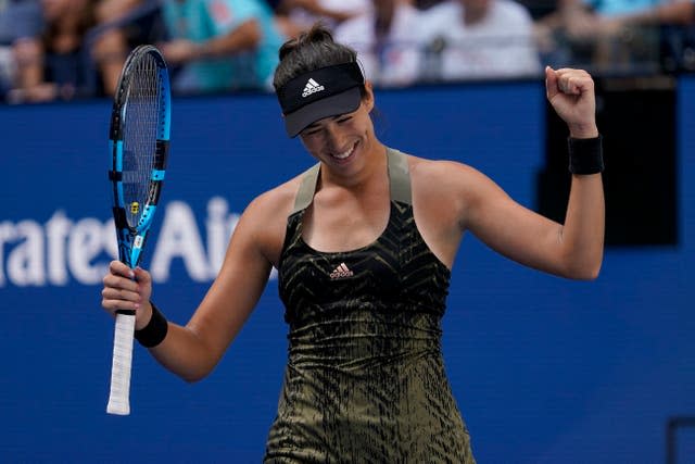 Garbine Muguruza celebrates beating Victoria Azarenka