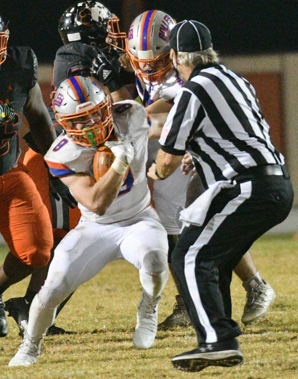 Kade Frew of Bolles tries to go around the referee during the Class 4A football state semifinal Friday, Dec. 3. Craig Bailey/FLORIDA TODAY via USA TODAY NETWORK