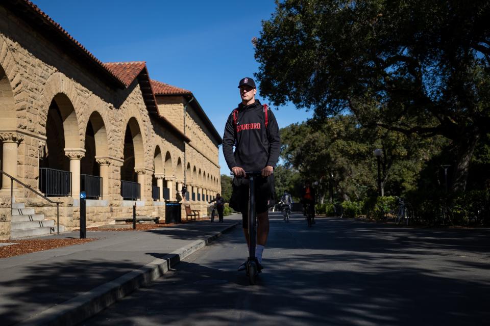 Tanner McKee rides his electric scooter through the Stanford University campus on the way to class in Stanford, California, on Monday, Nov. 8, 2021. | Spenser Heaps, Deseret News