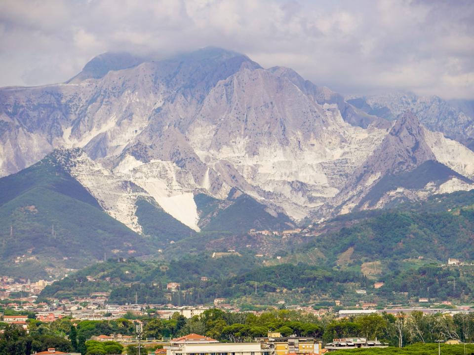 A marble mountain range on a cloudy day