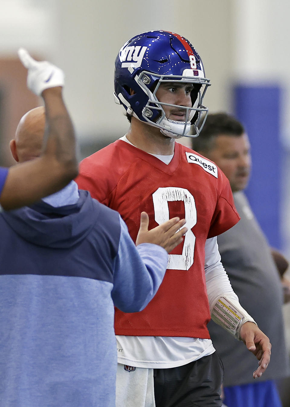 New York Giants head coach Brian Daboll pats quarterback Daniel Jones on the chest during NFL football practice Thursday, May 23, 2024, in East Rutherford, N.J. (AP Photo/Adam Hunger)