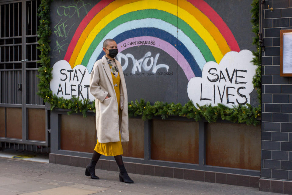  A woman wearing a face mask walks past the Stay Alert Save Lives Rainbow Sign in Soho.
As daily Covid19 infection rate hits record high in London, the government is pinning its hopes on the Oxford/AstraZeneca jab. (Photo by Pietro Recchia / SOPA Images/Sipa USA) 