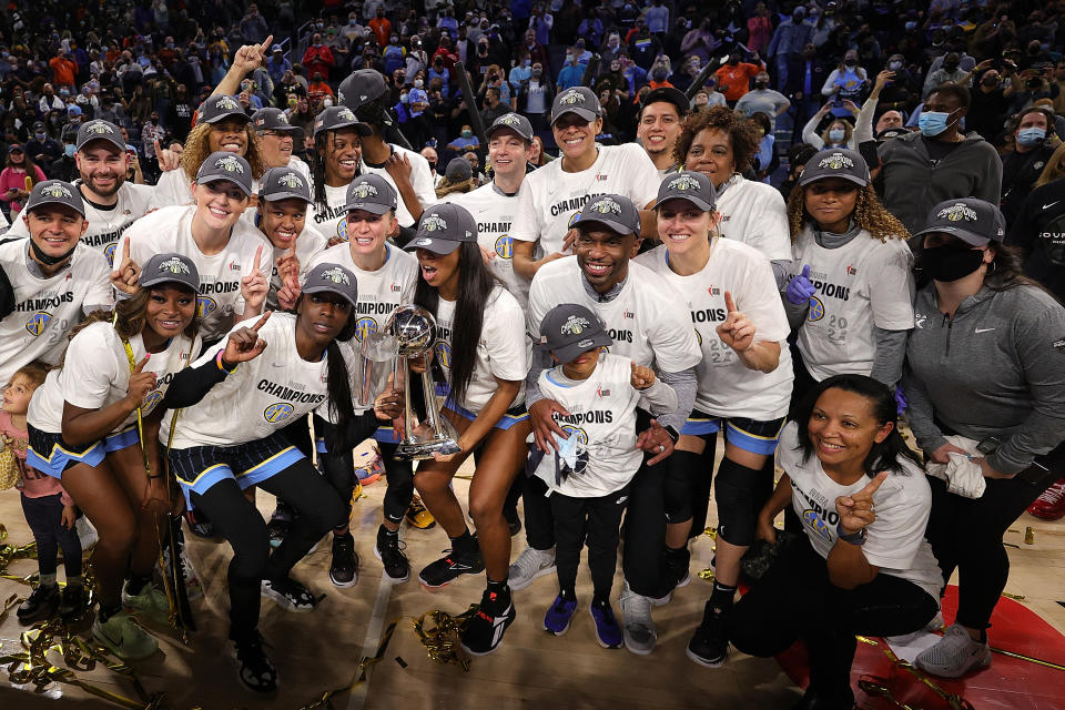 Members of the Chicago Sky pose with the championship trophy.