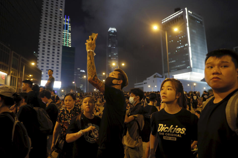 Protesters gather into the night against an unpopular extradition bill in Hong Kong on Sunday, June 16, 2019. Hong Kong citizens marched for hours Sunday in a massive protest that drew a late-in-the-day apology from the city's top leader for her handling of legislation that has stoked fears of expanding control from Beijing in this former British colony. (AP Photo/Kin Cheung)