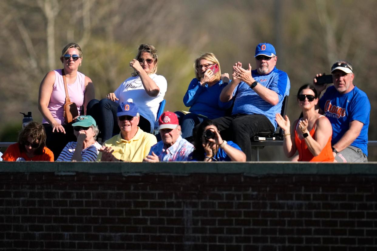 Olentangy Orange fans applaud during a baseball game at Dublin Coffman last year. Dublin and Olentangy schools are closed and sports practices and events have been rescheduled because of Monday's solar eclipse.