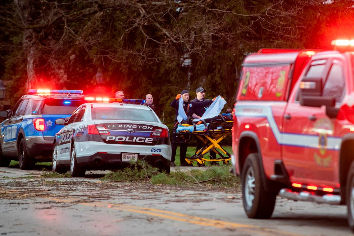 Firefighters and EMS respond to a person injured from fallen trees from the storm in Lexington, Ky., Friday, March 3, 2022.