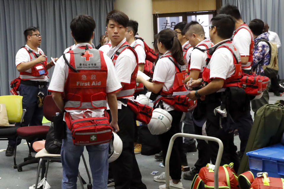 Medical volunteers prepare for their duties on the remaining protesters at Polytechnic University in Hong Kong, Tuesday, Nov. 26, 2019. Hong Kong’s embattled leader Carrie Lam refused to offer any concessions to anti-government protesters despite a local election setback, saying Tuesday that she will instead accelerate dialogues and identify ways to address societal grievances. (AP Photo/Vincent Thian)