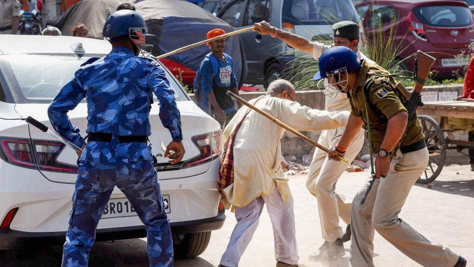 Police baton charge a protestor during the Vidhan Sabha march, organised by the members of Inqilab Naujawan Sabha and All India Students Association (AISA), against the state government on the issues of education and health, in Patna, Monday, 1 March, 2021.