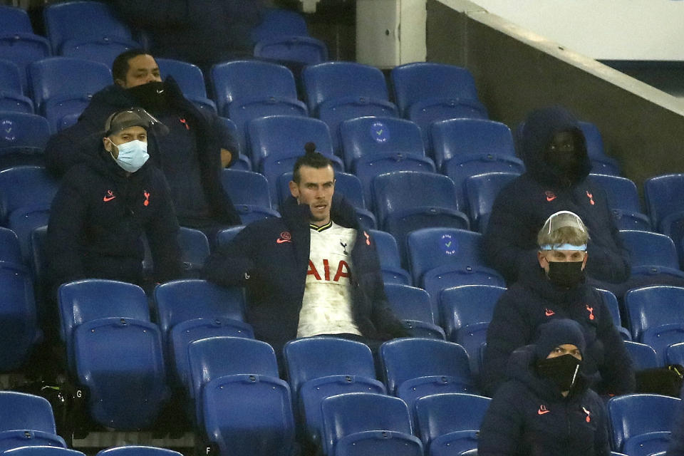 Tottenham's Gareth Bale sits in the stand watching the match after being substituted during an English Premier League soccer match between Brighton and Tottenham Hotspur at the Amex stadium in Brighton, England, Sunday Jan. 31, 2021. (Andrew Boyers/Pool via AP)