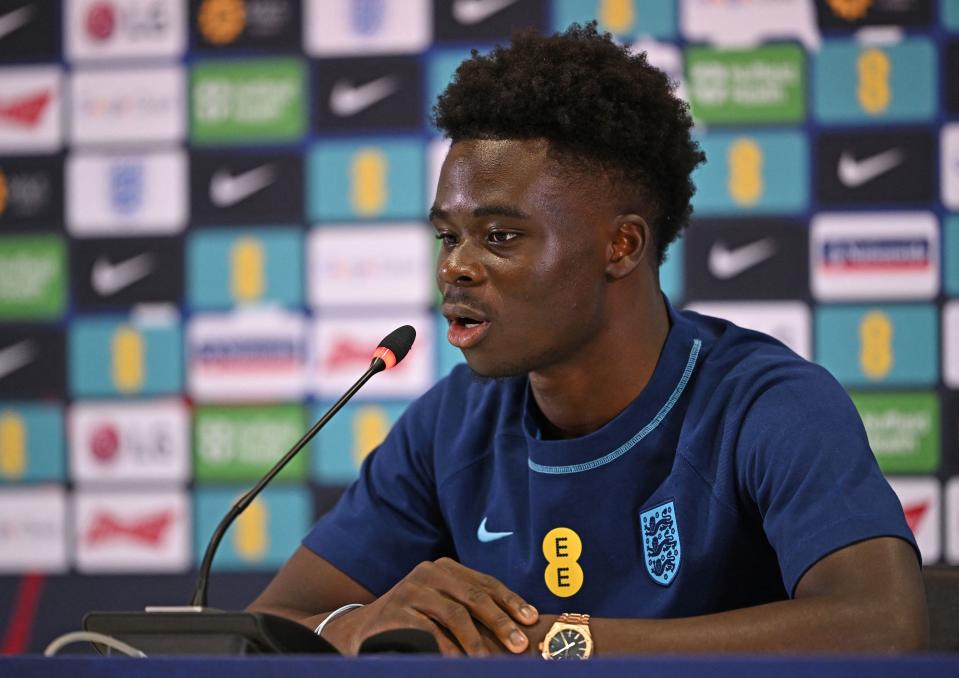 Englands Bukayo Saka attends a press conference at Al Wakrah SC Stadium in Al Wakrah, south of Doha on December 5, 2022 during the Qatar 2022 World Cup football tournament. (Photo by Paul ELLIS / AFP) (Photo by PAUL ELLIS/AFP via Getty Images)