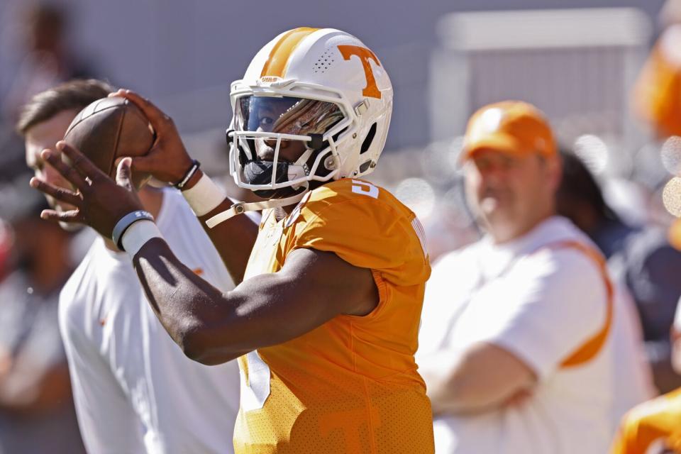 Tennessee quarterback Hendon Hooker warms up before a game against Alabama.