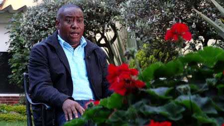 Leyner Palacios, survivor of a FARC attack and victims association leader speaks during a Reuters interview in Bogota, Colombia June 6, 2018. Picture taken June 6, 2018. REUTERS/Luis Jaime Acosta