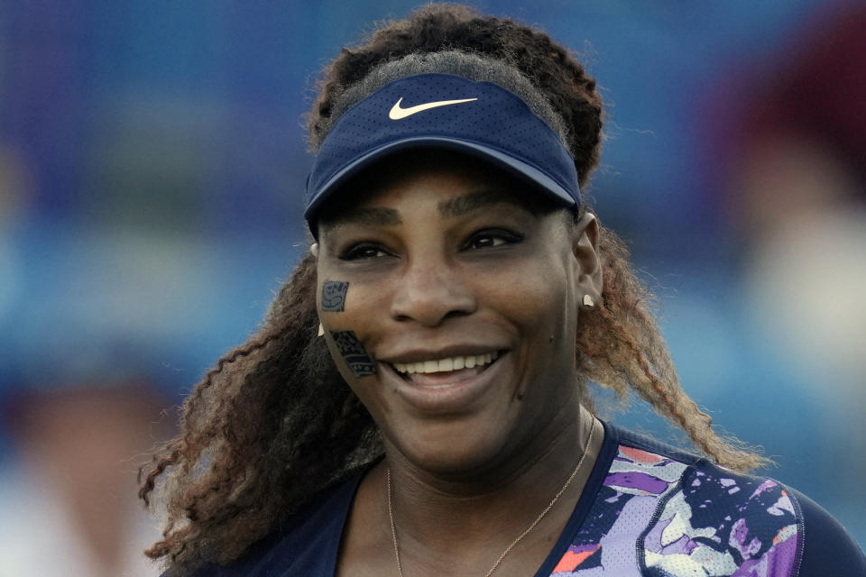 FILE - Serena Williams laughs during her quarterfinal doubles tennis match with Ons Jabeur of Tunisia against Shuko Aoyama of Japan and Hao-Ching of Taiwan at the Eastbourne International tennis tournament in Eastbourne, England, Wednesday, June 22, 2022. Serena Williams will be competing in the 2022 Wimbledon tennis tournament. (AP Photo/Kirsty Wigglesworth, File)