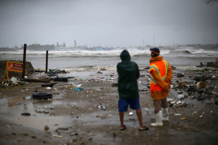 People look out to the sea as Hurricane Irma moves off the northern coast of the Dominican Republic, in Puerto Plata, Dominican Republic, September 7, 2017. REUTERS/Ivan Alvarado