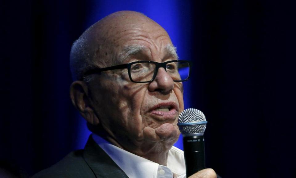 Rupert Murdoch, Executive Chairman of News Corp and 21st Century Fox, is seen holding a microphone