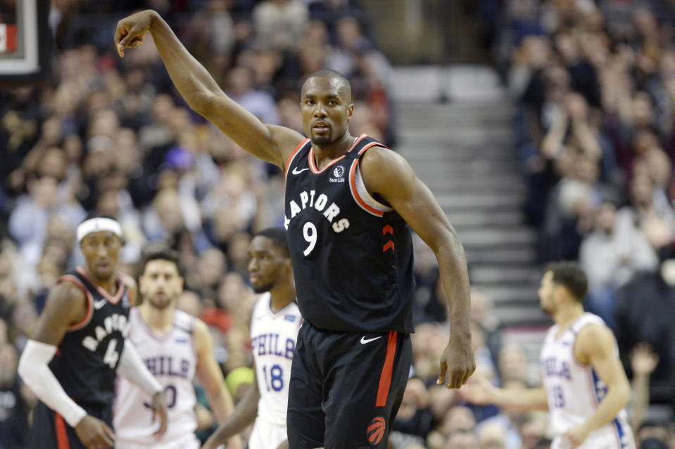 Toronto Raptors forward Serge Ibaka (9) celebrates a three-pointer during the second half of an NBA basketball game against the Philadelphia 76ers, Wednesday, Jan. 22, 2020 in Toronto. (Nathan Denette/The Canadian Press via AP)