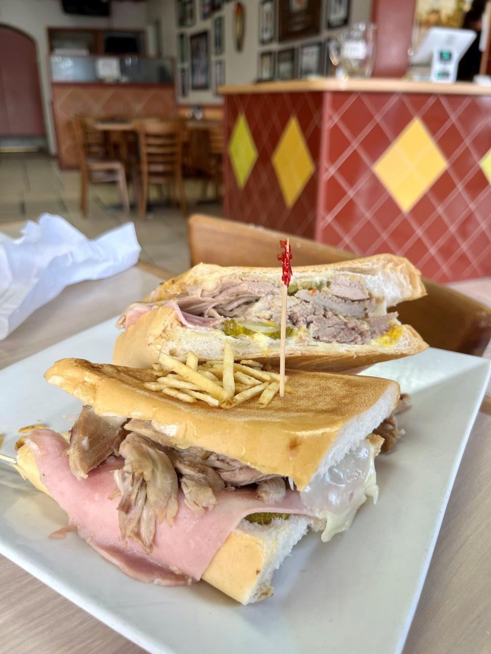 Order Azucar Restaurant & Bakery's thick, two-hander of a Cuban sandwich with a side of congri and you’ll be taking half of it home.