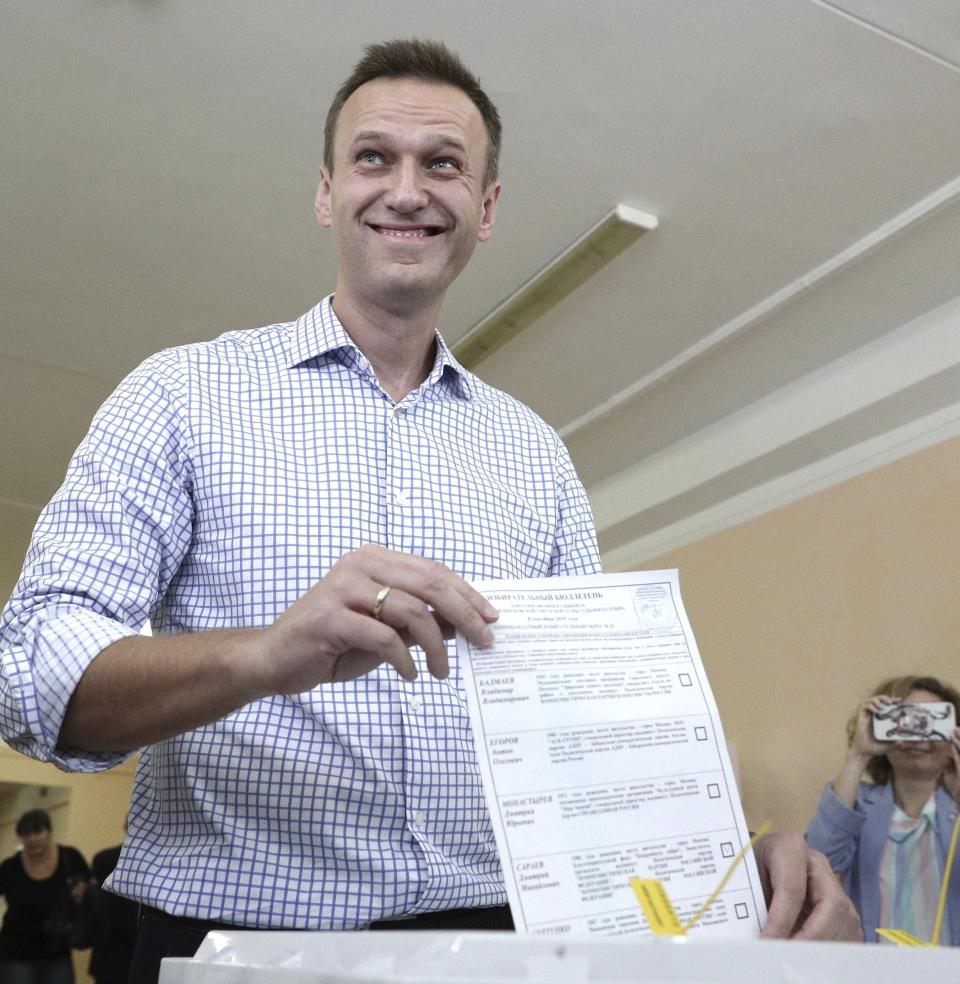Russian opposition leader Alexei Navalny casts his ballot during a city council election in Moscow, Russia, Sunday, Sept. 8, 2019. Residents of Russia's capital are voting in a city council election that is shadowed by a wave of protests that saw the biggest demonstrator turnout in seven years and a notably violent police response. (AP Photo/Andrew Lubimov)