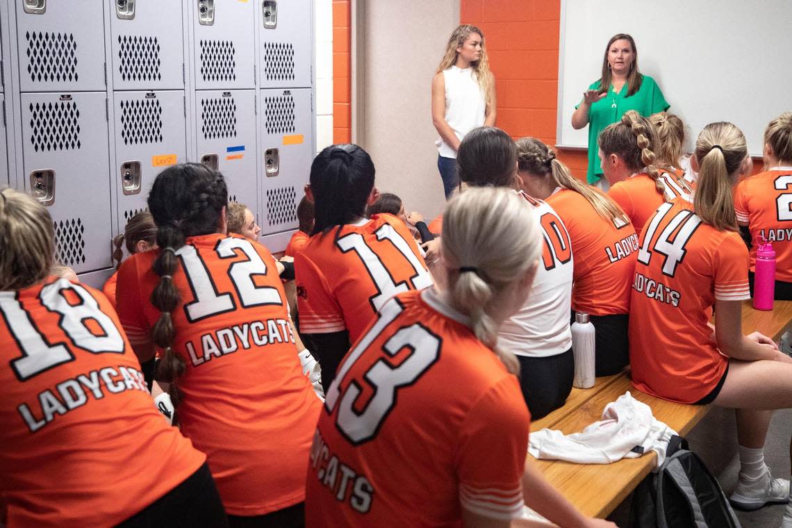 The Aledo High School varsity volleyball team meets with their coach Claire Gay.