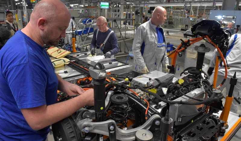 Employees work at a production line of a a new electric Volkswagen model ID.3 in Zwickau