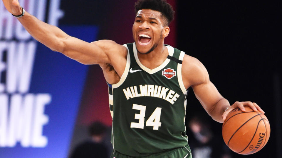 Giannis Antetokounmpo is pictured handling the ball in an NBA game against the Washington Wizards.