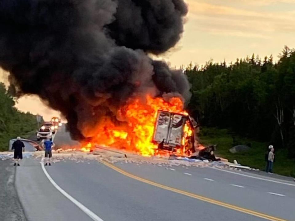 An eyewitness photo provided to CBC News shows a tractor-trailer on fire on the Trans-Canada Highway near Bishop's Falls on Wednesday evening. (Submitted/Name withheld by CBC - image credit)