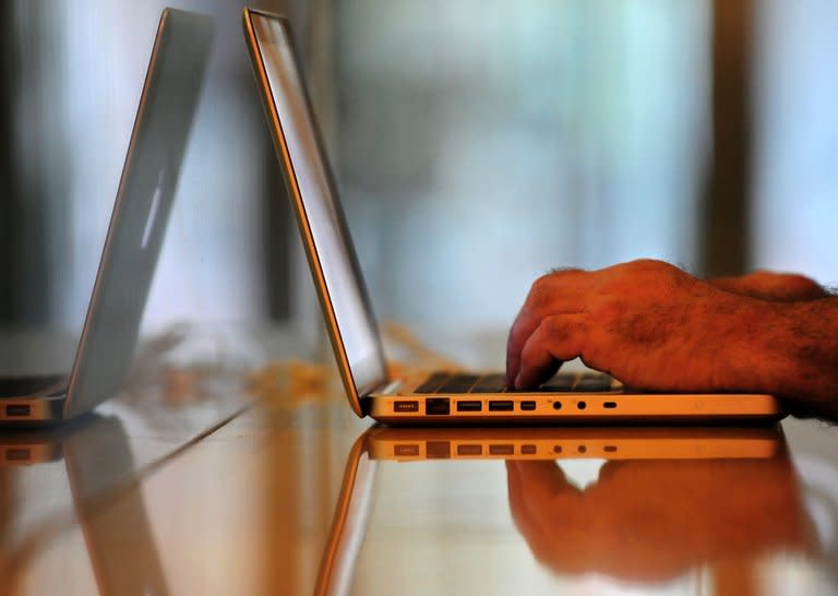 A man uses a laptop computer at a wireless cafe in Beijing on July 1, 2009. Defence ministers from NATO's 28 member states meet on Tuesday with cyber-defence top of the agenda, amid concerns about the threat posed by increasing cyber-attacks, many blamed on China