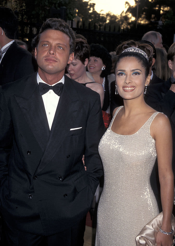 Salma in a shiny, strapless gown