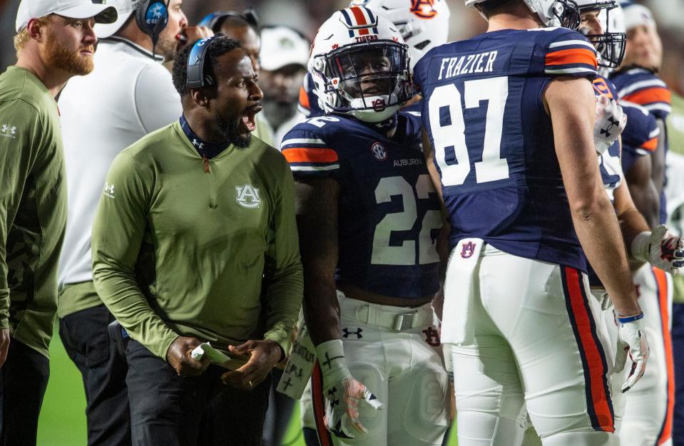 Auburn Tigers interim head coach Carnell "Cadillac" Williams talks with his team during a break in the action as Auburn Tigers take on Texas A&M Aggies at Jordan-Hare Stadium in Auburn, Ala., on Saturday, Nov. 12, 2022. Auburn Tigers lead Texas A&M 7-0 at halftime.