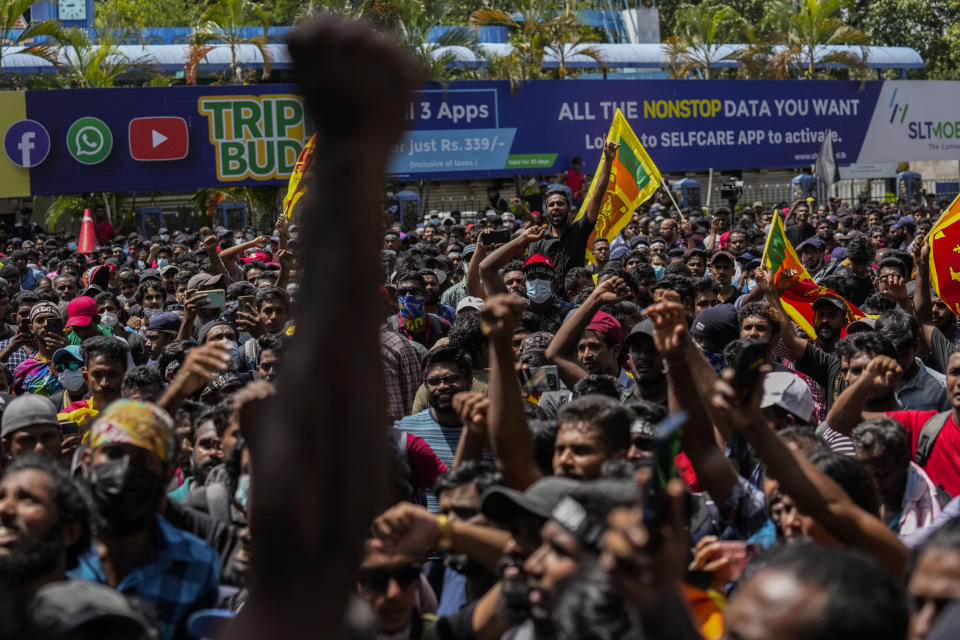 Protesters shout slogans before storming the Sri Lankan Prime Minister Ranil Wickremesinghe's office, demanding he resign after president Gotabaya Rajapaksa fled the country amid economic crisis in Colombo, Sri Lanka, Wednesday, July 13, 2022. Sri Lanka’s president fled the country without stepping down Wednesday, plunging a country already reeling from economic chaos into more political turmoil. Protesters demanding a change in leadership then trained their ire on the prime minister and stormed his office. (AP Photo/ Photo/Rafiq Maqbool)