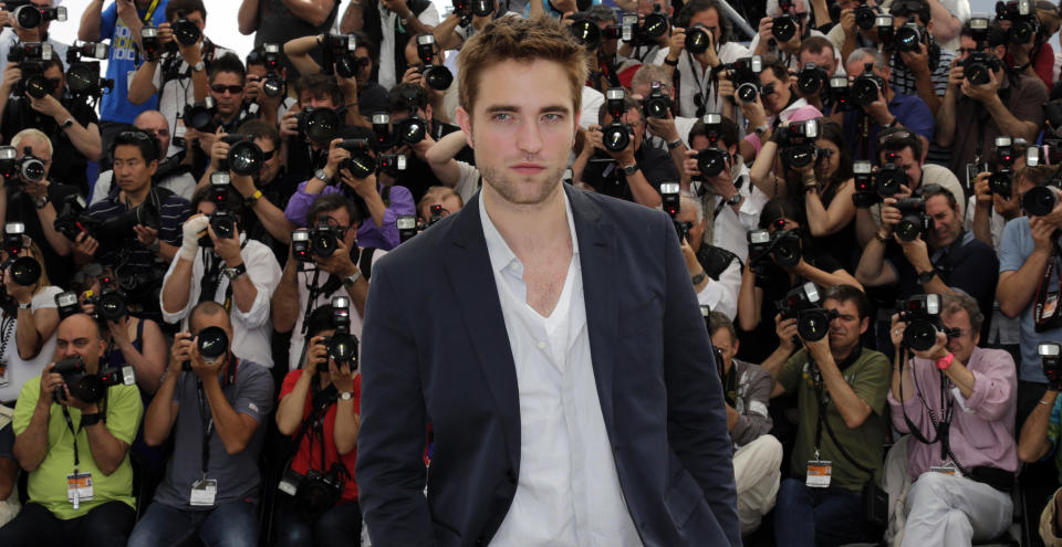 Cast member Robert Pattinson poses during a photocall for the film "Cosmopolis", in competition at the 65th Cannes Film Festival May 25, 2012.            REUTERS/Eric Gaillard (FRANCE  - Tags: ENTERTAINMENT)  