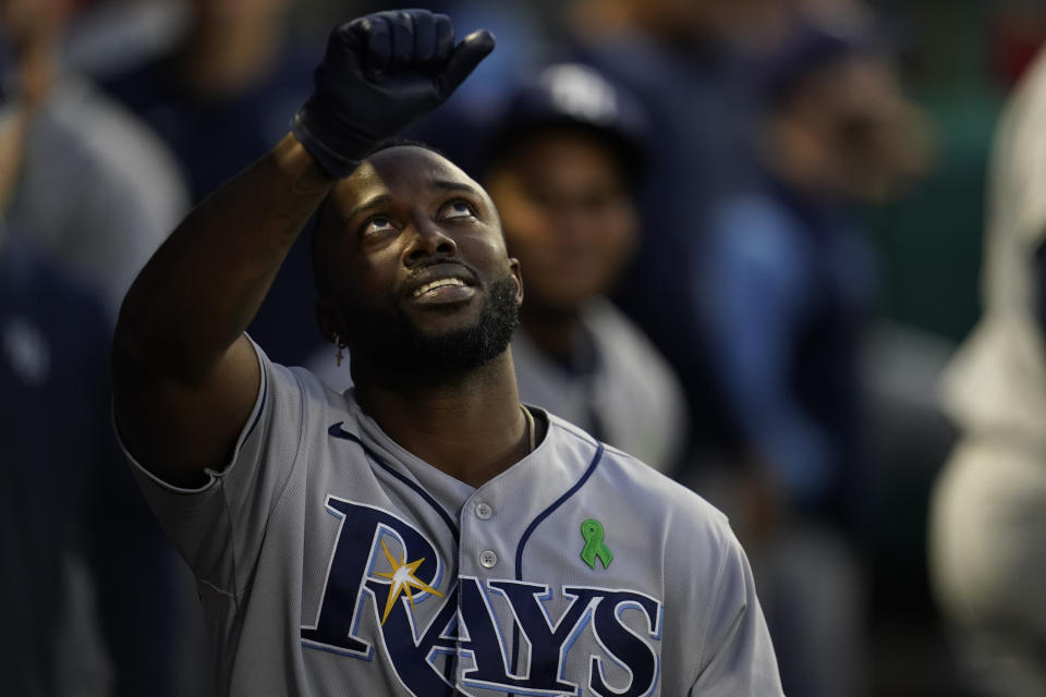 Tampa Bay Rays designated hitter Randy Arozarena, right, celebrates in the dugout after hitting a home run during the third inning of a baseball game against the Los Angeles Angels in Anaheim, Calif., Monday, May 9, 2022. (AP Photo/Ashley Landis)