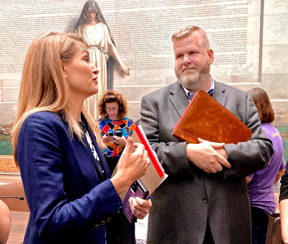 Sen. Carri Hicks, D-Oklahoma City, talks with Jeff Poyner, who has sponsored Afghan families, during an interim study session on Tuesday at the state Capitol.