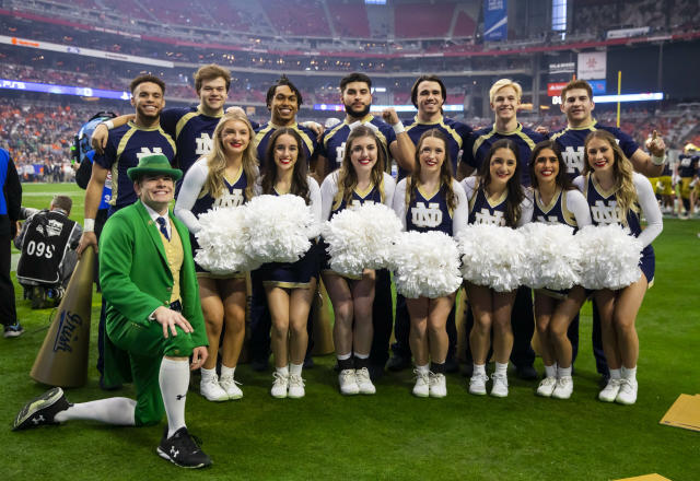 Notre Dame cheerleading squad and mascot practicing before