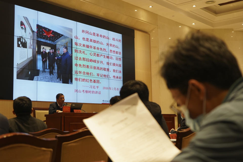 A lecturer conducts a class for students at the China Executive Leadership Academy in Jinggangshan in southeastern China's Jiangxi Province, on April 9, 2021. As China celebrates the 100th anniversary of its 1921 founding, such trainings are part of efforts by President Xi Jinping's government to extend party control over a changing society. (AP Photo/Emily Wang)