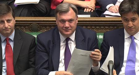 A still image taken from video shows Britain's Shadow Chancellor of the Exchequer Ed Balls (C) reacting to the budget delivered by Chancellor of the Exchequer George Osborne, in the House of Commons, in central London March 19, 2014. REUTERS/UK Parliament via REUTERS TV
