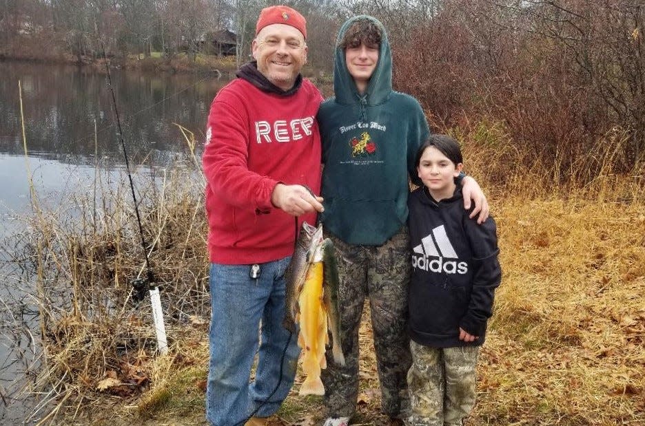 Kevin Tierney of Burrillville fished with stepsons Camryn Lions and Geo Curtis during a recent opening day. The trio caught seven trout, including two golden trout. Opening day this year is Saturday, April 13.