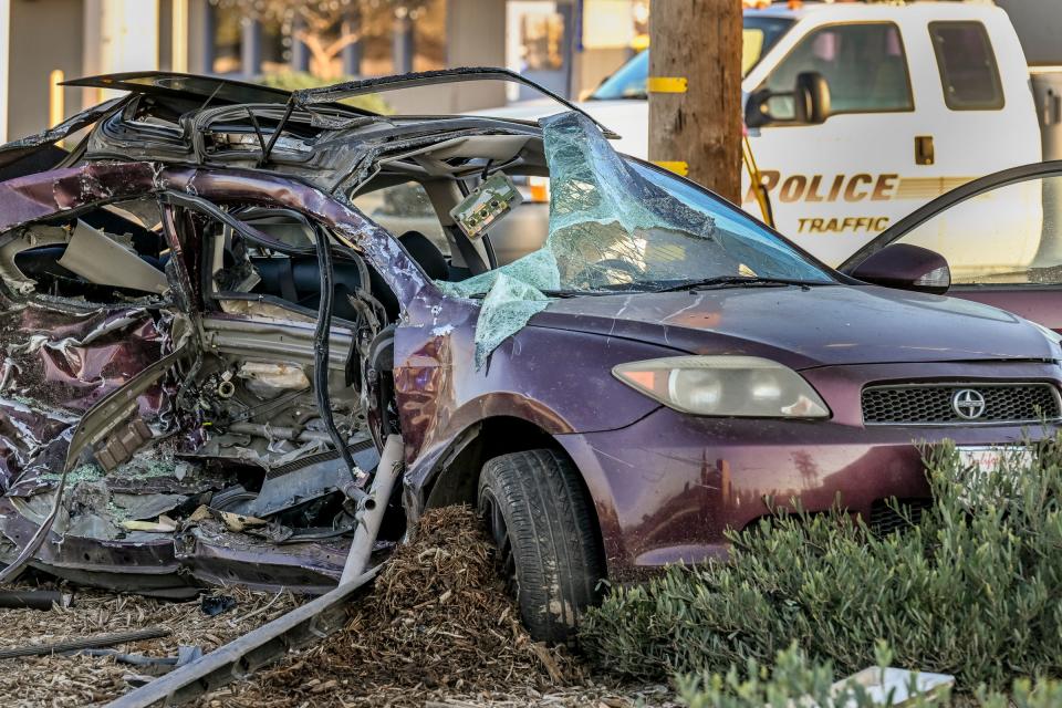 Visalia Police investigate a collision on Friday, January 27, 2023 on Ben Maddox Way just north of Douglass Avenue. Preliminary information suggests a northbound Scion tC crossed over into the path of a southbound Toyota Tacoma. One of the three occupants died at the hospital.