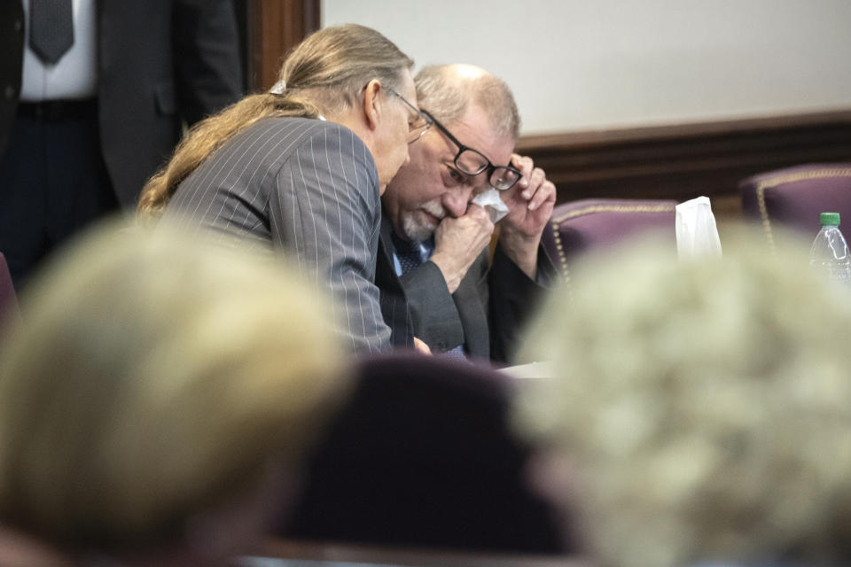 Greg McMichael wipes his eyes during a recess in the testimony of his son Travis McMichael during their trial and trial of their neighbor William "Roddie" Bryan at the Glynn County Courthouse, Wednesday, Nov. 17, 2021, in Brunswick, Ga. The three are charged with the February 2020 slaying of 25-year-old Ahmaud Arbery. (AP Photo/Stephen B. Morton, Pool)