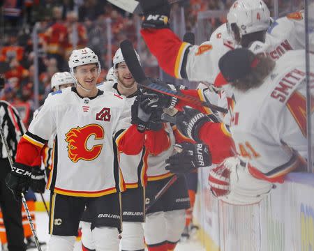 Jan 19, 2019; Edmonton, Alberta, CAN; Calgary Flames forward Michael Backlund (11) celebrates a third period goal against the Edmonton Oilers at Rogers Place. Mandatory Credit: Perry Nelson-USA TODAY Sports