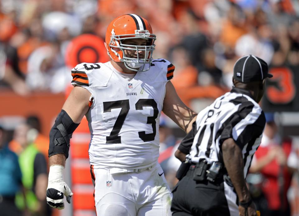 FILE - In this Sunday, Sept. 14, 2014 file photo, Cleveland Browns offensive tackle Joe Thomas (73) talks to umpire Roy Ellison (81) after Thomas was called for holding in the third quarter of an NFL football game against the New Orleans Saints in Cleveland. Cleveland's odds of making the postseason this season are extremely long, and Thomas, who's expected to earn his eighth straight Pro Bowl appearance, has accepted the Browns' likely fate, Thursday, Dec. 18, 2014. (AP Photo/David Richard, File)